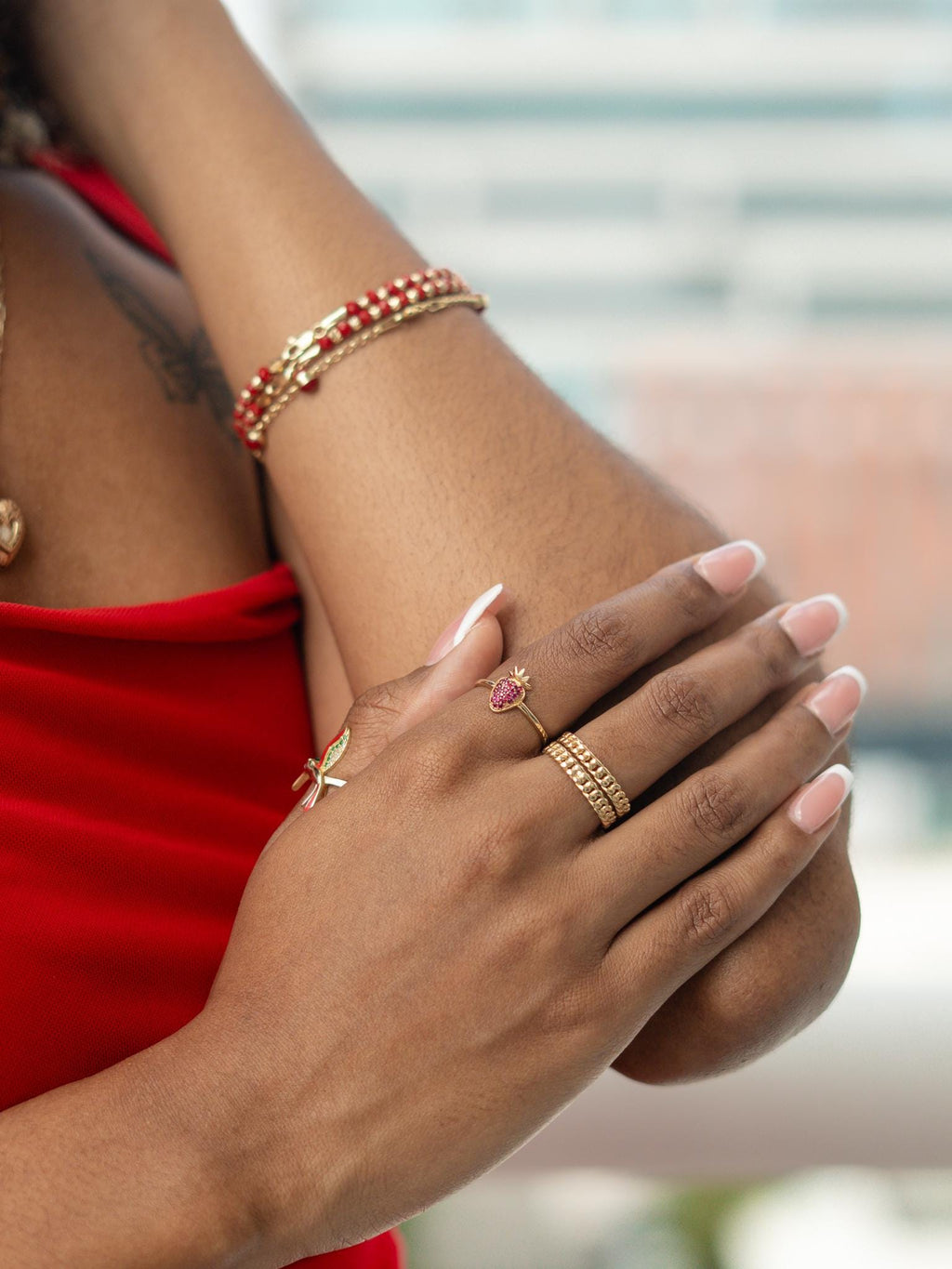 Three solid gold rings worn stacked on one hand